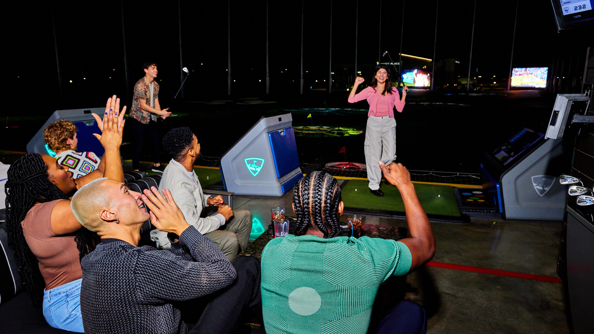 Group inside a bay at Topgolf